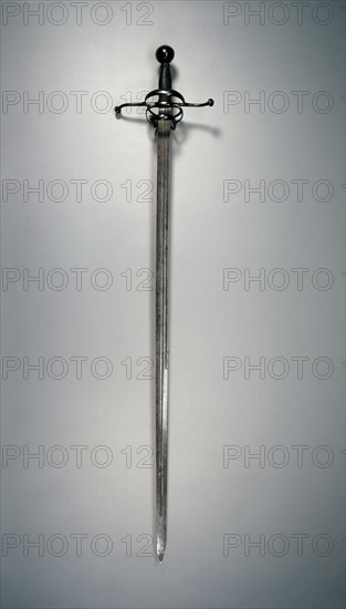 Rapier, c. 1610. Germany, early 17th Century. Steel; hilt of deeply blued steel; wood; overall: 125.2 cm (49 5/16 in.); blade: 110 cm (43 5/16 in.); quillions: 25 cm (9 13/16 in.); grip: 13.5 cm (5 5/16 in.).