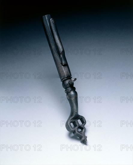 Combined Wheel-Lock Spanner and Powder Measure, c. 1625-1650. Germany, 17th century. Steel, trefoil top pierced with square holes; overall: 23.5 cm (9 1/4 in.); closed: 16.2 cm (6 3/8 in.).