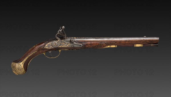 Pair of Flintlock Pistols, early 1700s. Franco-Flemish, Liège, early 18th century. Steel with gold inlay, gilt-brass mounts; walnut burl stock; chiseled high-relief decoration; overall: 49.5 cm (19 1/2 in.); barrel: 32.1 cm (12 5/8 in.); bore: 1.5 cm (9/16 in.).