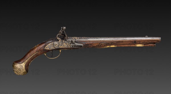 Pair of Flintlock Pistols, early 1700s. Franco-Flemish, Liège, early 18th Century. Steel with gold inlay, gilt-brass mounts; walnut burl stock; chiseled high-relief decoration; overall: 49.5 cm (19 1/2 in.); barrel: 32.1 cm (12 5/8 in.); bore: 1.5 cm (9/16 in.).