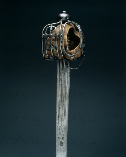 Basket-Hilted Broadsword,  Hilt: c. 1720, Blade: early 1700s. Hilt: Scotland; blade: Germany, Solingen, hilt: 18th Century. Steel; liner of buff leather; grip of wood, copper wire and fishskin (ray?); overall: 101.6 cm (40 in.); blade: 85.7 cm (33 3/4 in.); grip: 11 cm (4 5/16 in.); hilt: 12.8 cm (5 1/16 in.).
