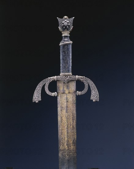 Parade Sword, c. 1500-1525. Italy, Ferrara, early 16th Century. Steel, etched and gilded; overall: 101.9 cm (40 1/8 in.); blade: 85.4 cm (33 5/8 in.); quillions: 17.5 cm (6 7/8 in.); grip: 11.1 cm (4 3/8 in.).