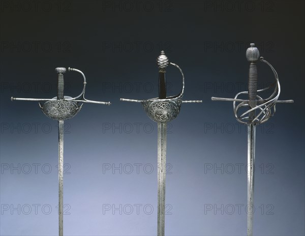 Cup-Hilted Rapier, c.1610- 30. Italy, Milan?, 17th century. Steel, pierced, chased and chiseled; wire ferrules on leather-covered wood grip; overall: 123.2 cm (48 1/2 in.); blade: 100.9 cm (39 3/4 in.); quillions: 25.2 cm (9 15/16 in.); grip: 11.8 cm (4 5/8 in.).