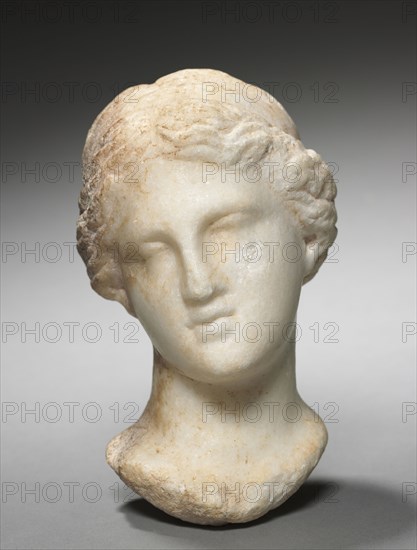 Head of a Woman, 3rd-2nd Century BC. Greece, Hellenistic period. Marble; overall: 16.6 x 9.6 x 9.6 cm (6 9/16 x 3 3/4 x 3 3/4 in.).