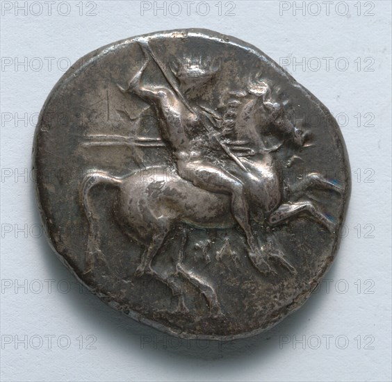 Stater, 334-302 BC. Greece, Tarentum, 4th century BC. Silver; diameter: 2.3 cm (7/8 in.).