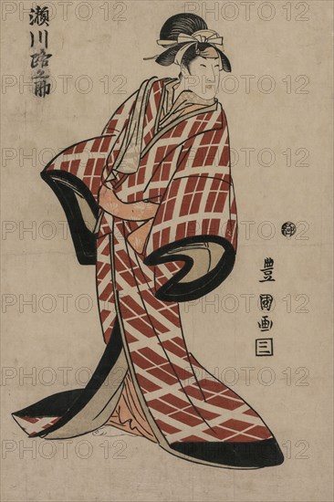 Segawa Michinosuke Wearing a Padded Plaid Robe, c. 1805. Utagawa Toyokuni (Japanese, 1769-1825). Color woodblock print; sheet: 38.4 x 23.8 cm (15 1/8 x 9 3/8 in.).