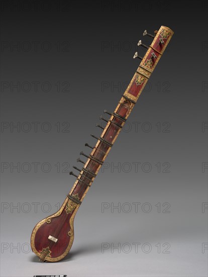 Vina, c. 1850. India, British Period (1858-1947). Painted and gilded wood with ivory veneers and inlay; copper alloy frets; iron alloy strings (with one modern copper replacement); overall: 95.2 x 15.3 cm (37 1/2 x 6 in.).