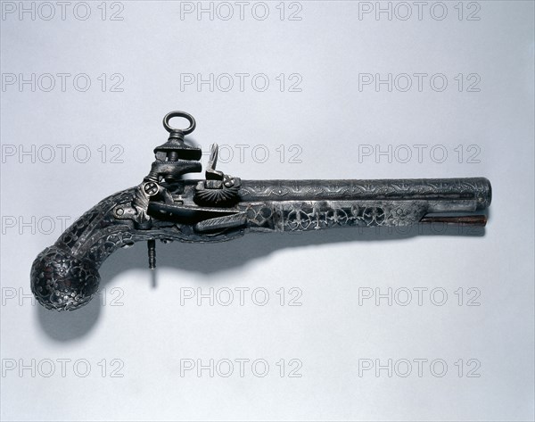 Snaphance Pistol, 17th century. Spain, Ripoll, 17th century. Steel, ebony with silver inlay; overall: 29.5 cm (11 5/8 in.); barrel: 20 cm (7 7/8 in.); bore: 1.5 cm (9/16 in.).
