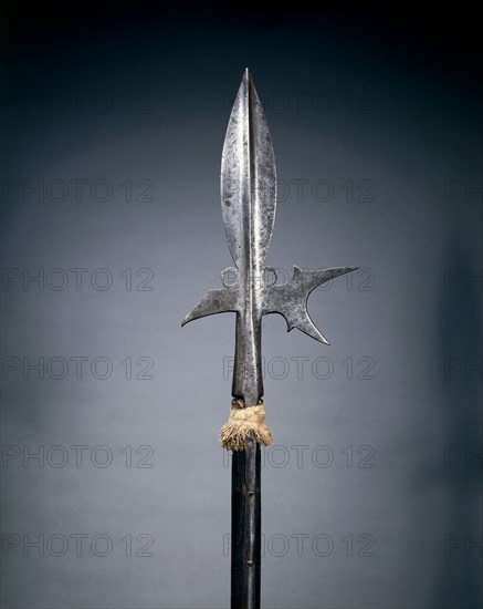 Halberd, c. 1580. Germany, late 16th Century. Steel; leaf-shaped head; octagonal woof haft, woolen pompom; overall: 197.5 cm (77 3/4 in.); blade: 22.8 cm (9 in.)