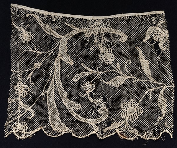 Fragment of a Border with Floral Motif, 18th century. Spain, 18th century. Needle lace, filet/lacis (knotted ground and darned in one and two directions); bleached linen (est.); overall: 30.1 x 37.6 cm (11 7/8 x 14 13/16 in.).