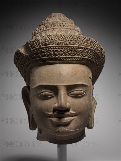 Head of a Deity or a Deified King, mid 900s. Cambodia, Koh Ker, Reign of Jayavarman IV, 928-941. Sandstone; overall: 37.4 cm (14 3/4 in.).