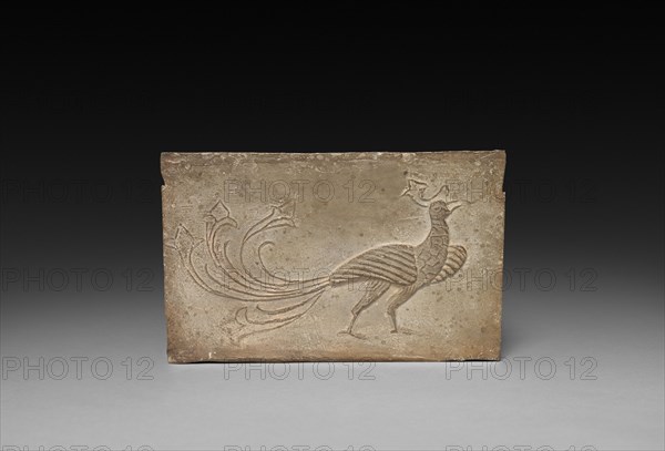Panel from Model Cooking Stove:  Bird and Phoenix, 1st Century BC. China, from a tomb in Sian-fu, Shensi province, Western Han dynasty (202 BC-AD 9). Earthenware with impressed relief decoration; overall: 12.1 x 18.4 cm (4 3/4 x 7 1/4 in.).