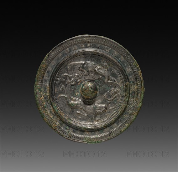 Mirror with Paired Felines, late 6th-7th Century. China, Sui dynasty (581-618) - Tang dynasty (618-907). Bronze; diameter: 14.5 cm (5 11/16 in.).