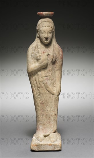 Kore Holding a Dove, 525-500 BC. Greece, Rhodes, late 6th Century BC. Terracotta; overall: 23 cm (9 1/16 in.).