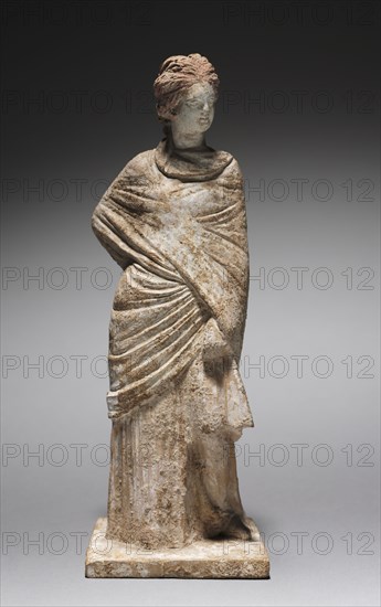 Female Figurine, 400-200 BC. Greece, Tanagra (Boeotia), 4th-3rd Century BC. Molded terracotta, painted; overall: 23.5 cm (9 1/4 in.).