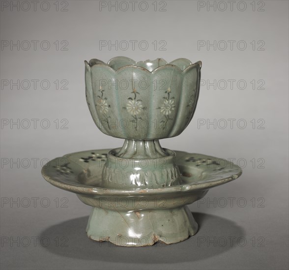 Floral-shaped Cup and Saucer with Inlaid Chrysanthemum Design, 1100s. Korea, Goryeo period (918-1392). Celadon ware with inlaid white and black slip decoration; diameter of mouth: 7.9 cm (3 1/8 in.); overall: 11.5 cm (4 1/2 in.).