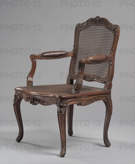 Arm Chair, c.1740. René Cresson (French, c. 1705-c. 1749). Carved wood, cane; overall: 95.6 x 70.5 x 60 cm (37 5/8 x 27 3/4 x 23 5/8 in.).