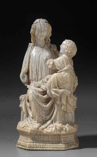 Enthroned Virgin and Child, c. 1250. Mosan, Valley of the Meuse, Gothic period, 13th century. Ivory; with base: 15.9 cm (6 1/4 in.); without base: 13.4 x 9.6 x 6.7 cm (5 1/4 x 3 3/4 x 2 5/8 in.).