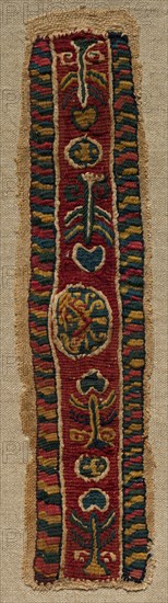 Fragment with an Ornamental Band, mid 700s - mid 800s. Egypt, Abbasid period, mid-8th to mid-9th century. Tabby weave with inwoven tapestry ornament, linen and wool; overall: 6.1 x 24.5 cm (2 3/8 x 9 5/8 in.).