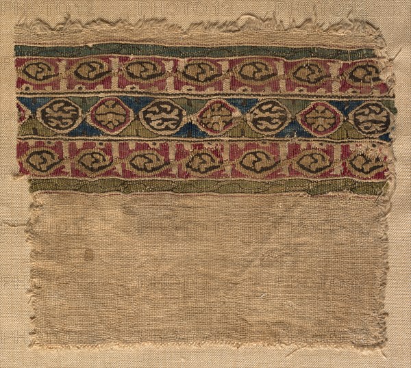 Fragment of a Tiraz-Style Textile, 1081 - 1101. Egypt, Fatimid period, Caliphate of al-Mustansir or al-Musta'li, c. AH 475-495, 11th-12th Century. Tabby ground with inwoven tapestry ornament; linen and silk; overall: 9.6 x 10.8 cm (3 3/4 x 4 1/4 in.)