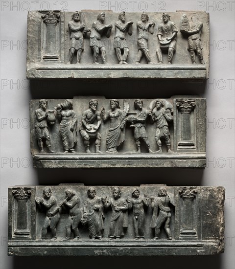 Bacchanalian Relief, 1-100. Pakistan, Gandhara, Buner area, early Kushan Period (AD 1-320). Schist; overall: 49.6 x 150.5 cm (19 1/2 x 59 1/4 in.); first section: 17.1 x 44.5 cm (6 3/4 x 17 1/2 in.); second section: 16.5 x 53 cm (6 1/2 x 20 7/8 in.); third section: 16 x 53 cm (6 5/16 x 20 7/8 in.).