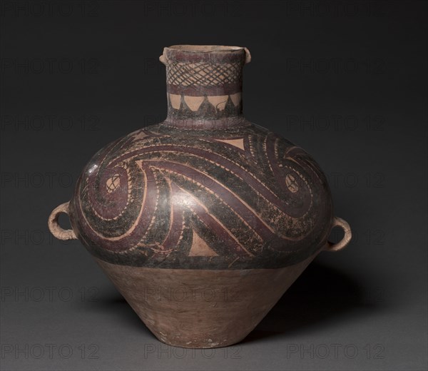 Jar with Curvilinear Designs, 2650-2350 BC. Northwest China, Neolithic period, Majiayao culture, Banshan phase (2650-2350 BC). Earthenware with slip-painted decoration; diameter: 36.8 x 30.5 cm (14 1/2 x 12 in.); overall: 36.2 cm (14 1/4 in.).