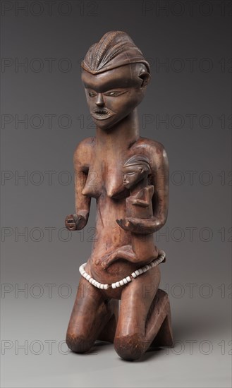 Mother-and-Child Figure, late 1800s-early 1900s. Central Africa, Democratic Republic of the Congo, Pende, late 19th-early 20th century. Wood, metal, beads; overall: 53.4 x 13.1 x 14.6 cm (21 x 5 3/16 x 5 3/4 in.)