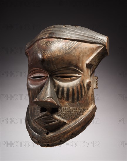 Helmet Mask, mid-late 1800s. Central Africa, Democratic Republic of the Congo, Kuba, mid-late 19th century. Wood and pigment; overall: 43.3 x 31.2 x 28.3 cm (17 1/16 x 12 5/16 x 11 1/8 in.)