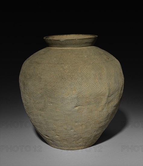 Jar, 481-221. China, reportedly Ch'angsha, Hunan province, Eastern Zhou dynasty (771-256 BC), Warring States period (475-221 BC). Earthenware with stamped decoration; diameter of mouth: 12.8 cm (5 1/16 in.); overall: 25.7 cm (10 1/8 in.).