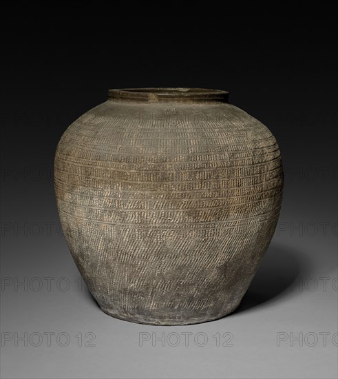 Jar, 481-221. China, reportedly Ch'angsha, Hunan province, Eastern Zhou dynasty (771-256 BC), Warring States period (475-221 BC). Earthenware with impressed and incised decoration; diameter of mouth: 23 cm (9 1/16 in.); overall: 41 cm (16 1/8 in.).