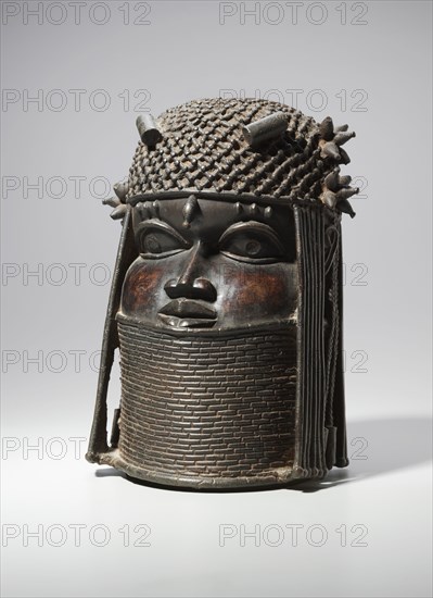 Head, possibly mid 1500s or early 1600s. Guinea Coast, Nigeria, Benin Kingdom, Edo, possibly mid 16th or early 17th century. Brass; overall: 29.9 x 21.6 x 20.4 cm (11 3/4 x 8 1/2 x 8 1/16 in.)