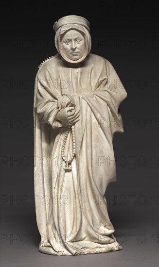 Mourner from the Tomb of Philip the Bold, Duke of Burgundy (1364-1404), 1404-1410. Claus de Werve (Netherlandish, 1380-1439). Vizille alabaster; overall: 41.7 x 16.6 x 11.7 cm (16 7/16 x 6 9/16 x 4 5/8 in.).