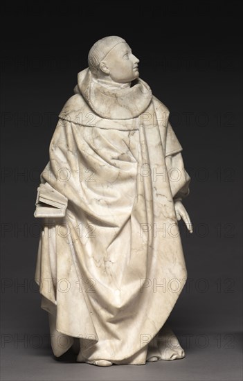Mourner from the Tomb of John the Fearless and Margaret of Bavaria, 1443-45. Jean de la Huerta (Spanish). Salins alabaster; overall: 41 x 20.3 x 12.4 cm (16 1/8 x 8 x 4 7/8 in.).