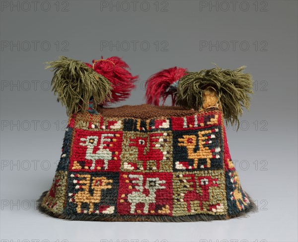 Four-Cornered Hat, c. 700-1100 A.D.. Peru, South Coast, Wari Culture, Middle Horizon, 8th-11th Century. Needle network with cut pile: cotton and wool; reseau for top: cotton; overall: 14.3 x 15 x 15.5 cm (5 5/8 x 5 7/8 x 6 1/8 in.)