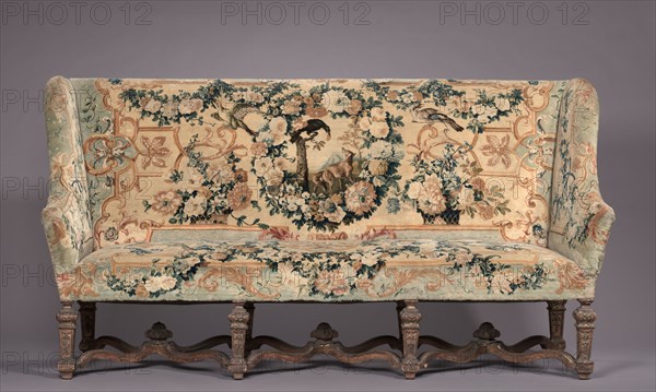 Settee, before 1717. Royal Savonnerie Manufactory, Chaillot Workshops (French, est. 1627). Carved wood, Savonnerie knotted-pile (symmetrical rug knot) upholstery; wool, hemp ; overall: 120 x 201.3 x 55.9 cm (47 1/4 x 79 1/4 x 22 in.).