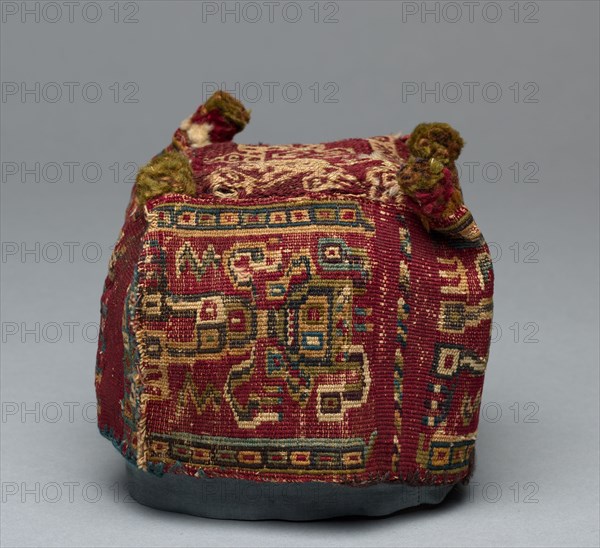 Four-Cornered Hat, c. 700-1100. Peru, South Coast, Wari Culture, Middle Horizon, 8th-12th Century. Sides: cotton and wool plain cloth, brocaded; top: wool fancy cloth (?); overall: 10.8 x 13 x 13 cm (4 1/4 x 5 1/8 x 5 1/8 in.)