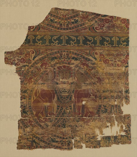 Lampas with lion strangler, from a dalmatic of Saint Bernard Calvo, 1200-1243. Spain, Almeria, Almoravid period. Lampas, taqueté, and plain-weave variant: silk and gold thread; overall: 43.8 x 39.7 cm (17 1/4 x 15 5/8 in.)