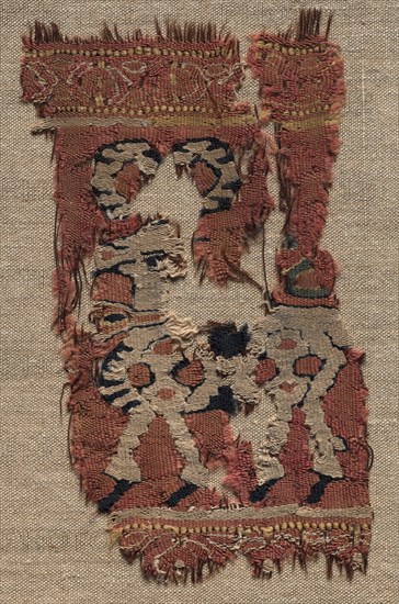 Fragment (from a Garment?), late 700s - early 800s. Iran or Iraq, early Abbasid period, late 8th - early 9th century. Tapestry (originally inwoven in tabby ground); goat hair, wool and cotton; overall: 15.9 x 11.5 cm (6 1/4 x 4 1/2 in.).