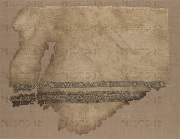 Fragment of a Tiraz, 1050 - 1058. Egypt, Fatimid period, Caliphate of al-Mustansir, c. AH 442-450 (A.D. 1050-1058). Tabby ground with inwoven tapestry ornament; linen and silk; overall: 22.3 x 27.3 cm (8 3/4 x 10 3/4 in.)