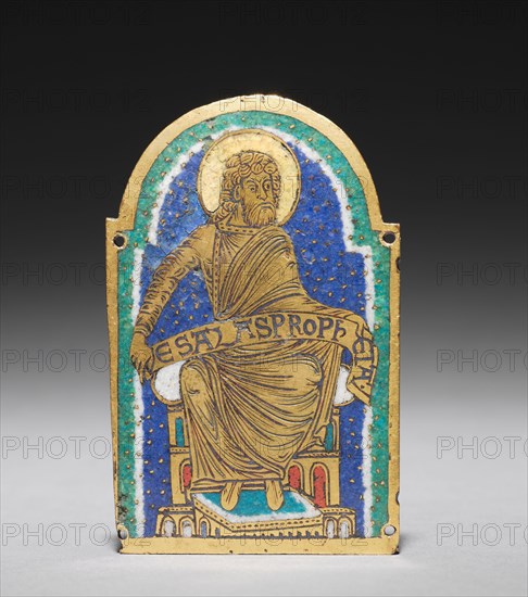 Plaque: Seated Prophet from a Reliquary Shrine: Esais (Isaiah), c. 1170-1180. Germany, Lower Saxony, Hildesheim, Romanesque period, 12th century. Gilded copper, champlevé enamel; overall: 9 x 5.7 x 0.3 cm (3 9/16 x 2 1/4 x 1/8 in.).