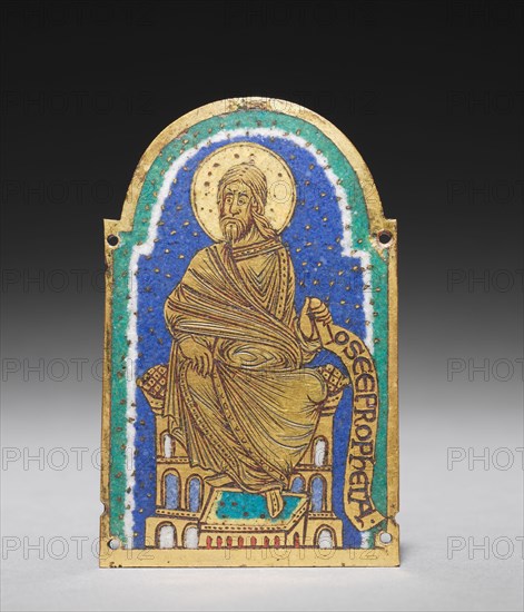 Plaque with Seated Prophet from a Reliquary Shrine: Osea (Hosea), c. 1170-1180. Germany, Lower Saxony, Hildesheim, Romanesque period, 12th century. Gilded copper, champlevé enamel; overall: 9 x 5.9 x 0.3 cm (3 9/16 x 2 5/16 x 1/8 in.).