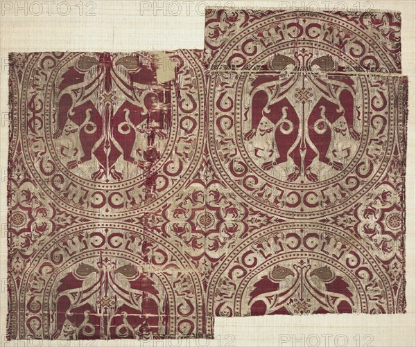 Lampas with griffins in roundels, from the Reliquary of Saint Librada in Siguenza Cathedral, 1100-1150. Spain, Almeria, Almoravid period. Lampas and plain-weave variant: silk and gold thread; overall: 37 x 40 cm (14 9/16 x 15 3/4 in.)