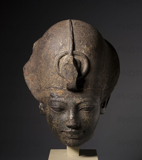 Head of Amenhotep III Wearing the Blue Crown, c. 1391-1353 BC. Egypt, New Kingdom, Dynasty 18, reign of Amenhotep III. Granodiorite; overall: 39.1 x 30.3 x 27.7 cm (15 3/8 x 11 15/16 x 10 7/8 in.).