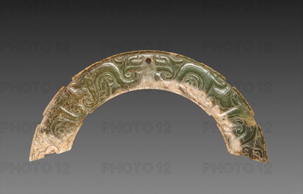 Arc-shaped Pendant with Animal Mask and Interlaced Animal Bands (Huang), 300-100 BC. China, Warring States period (475-221 BC) to Western Han dynasty (202 BC-AD 9). Nephrite; overall: 12.8 cm (5 1/16 in.).