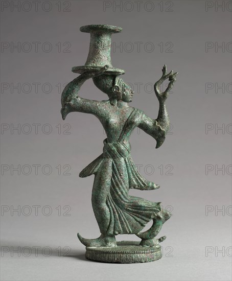 Candelabrum Stand of a Dancing Maenad, 525-500 BC. Italy, Etruscan, late 6th Century BC. Bronze; overall: 18.8 cm (7 3/8 in.).