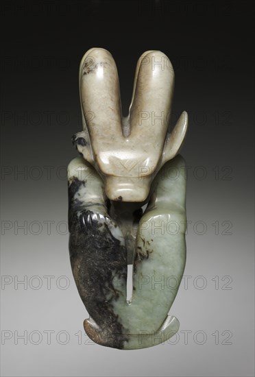 Amulet in the Form of a Seated Figure with Bovine Head, c. 4700-2920 BC. Northeast China, Neolithic period, probably Hongshan culture (4700-2920 BC). Jade (nephrite); overall: 13.2 cm (5 3/16 in.).