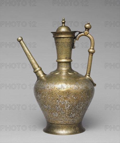Luxury Ewer Extending Good Fortune to the Owner, 1223. Ahmad al-Dhaki al-Mawsili (Iraq). Brass inlaid with silver; lid and base added