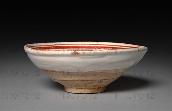 Cup: Cizhou ware, 1100s-1200s. China, Jin dynasty (1115-1234). Buff stoneware with underglaze slip application and overglaze enamel decoration; diameter: 11.8 cm (4 5/8 in.); overall: 4.5 cm (1 3/4 in.).