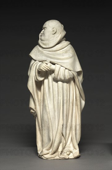 Mourner from the Tomb of Philip the Bold, Duke of Burgundy (1364-1404), 1404-1410. Claus de Werve (Netherlandish, 1380-1439). Vizille alabaster; overall: 41.1 x 17.6 x 11 cm (16 3/16 x 6 15/16 x 4 5/16 in.).