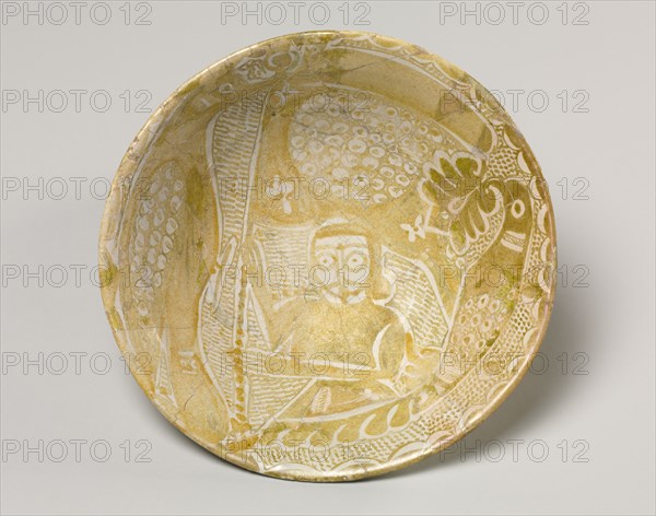 Luster Bowl with Man Holding a Banner, 900s. Iraq, probably Baghdad, Abassid Period, 10th Century. Earthenware with luster-painted design; diameter: 24.2 cm (9 1/2 in.); overall: 7.4 cm (2 15/16 in.).